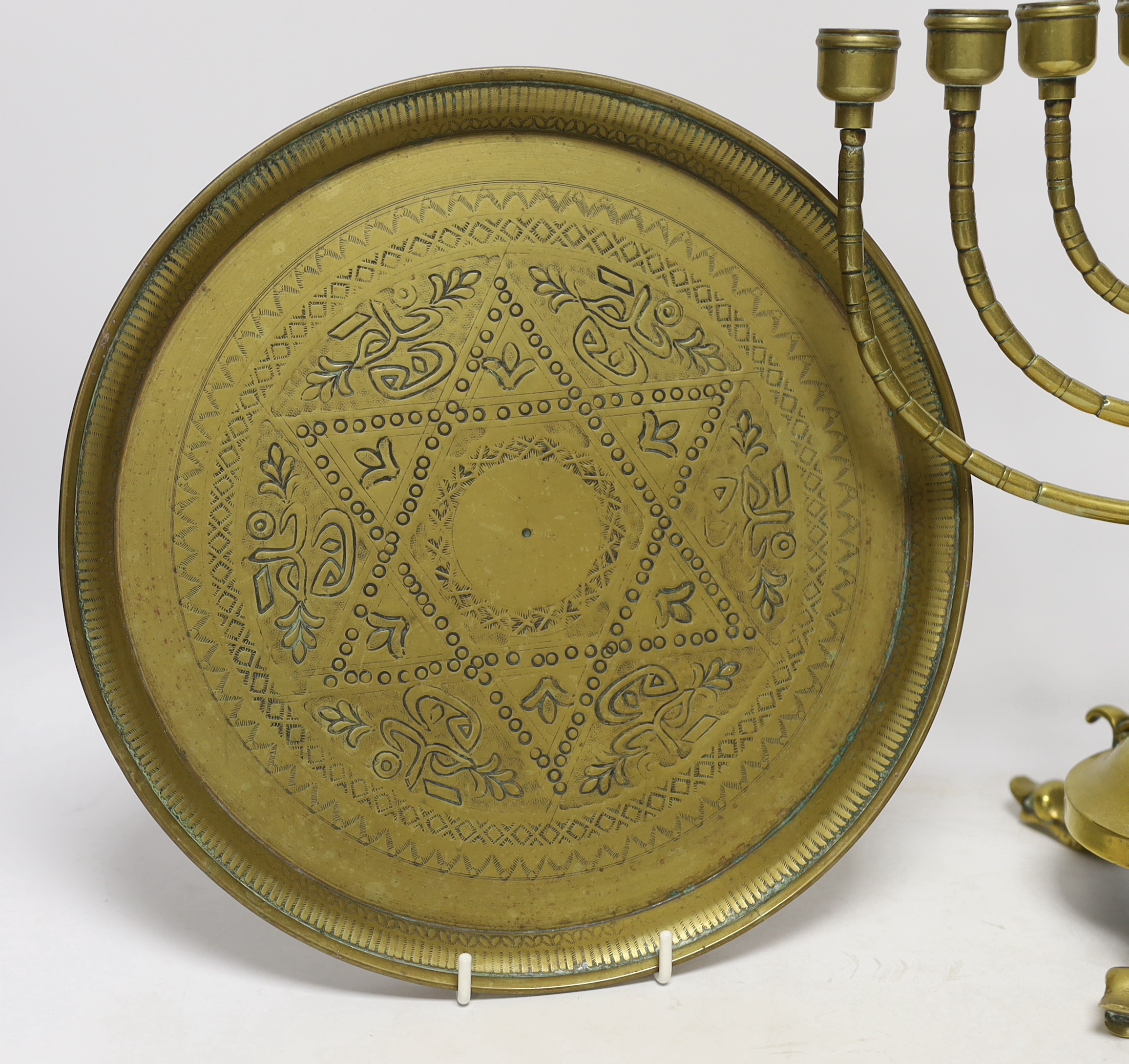 Two pieces of Judaica comprising brass Chanukka and circular dish, largest 31cm high